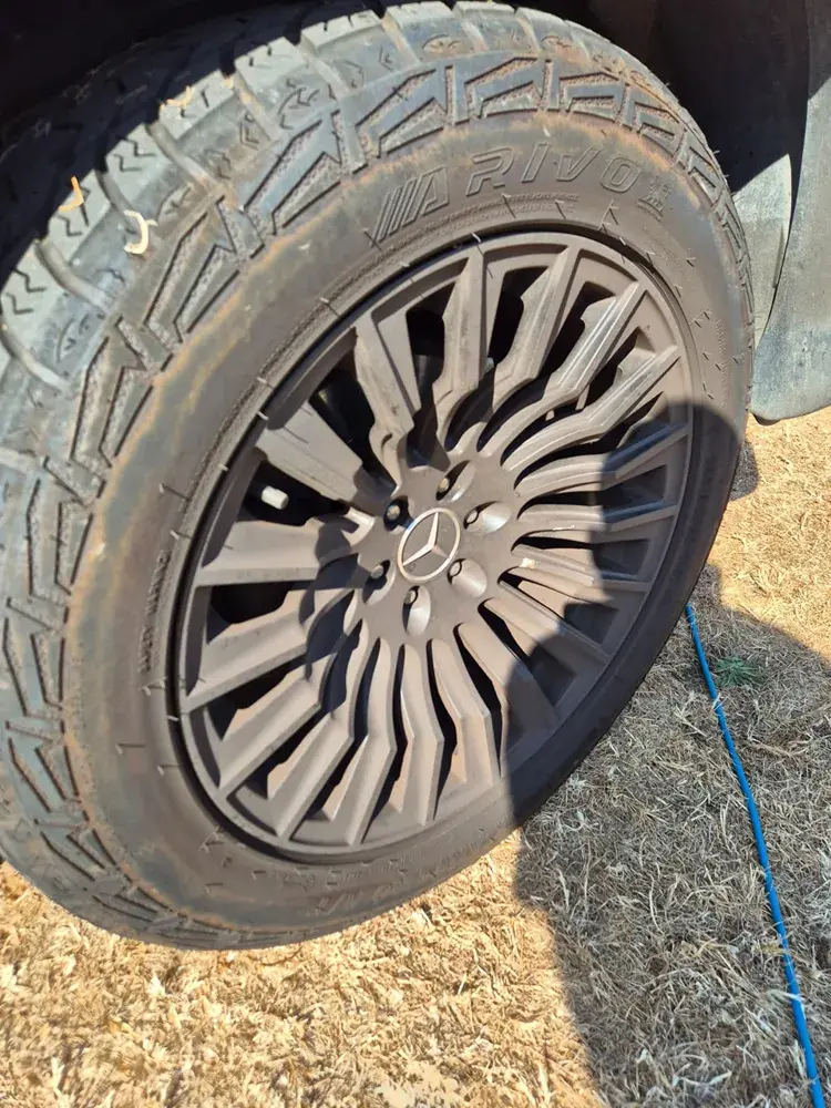 Mercedes wheel with dust covering the spokes and tyre before cleaning